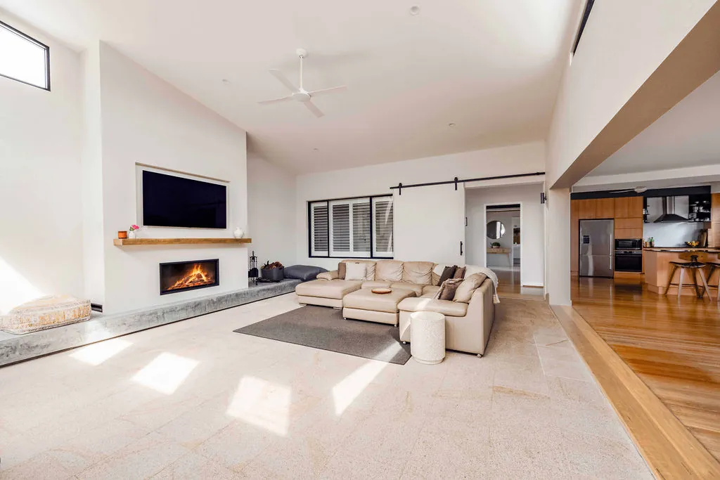Lounge room connecting to the existing kitchen and timber floors