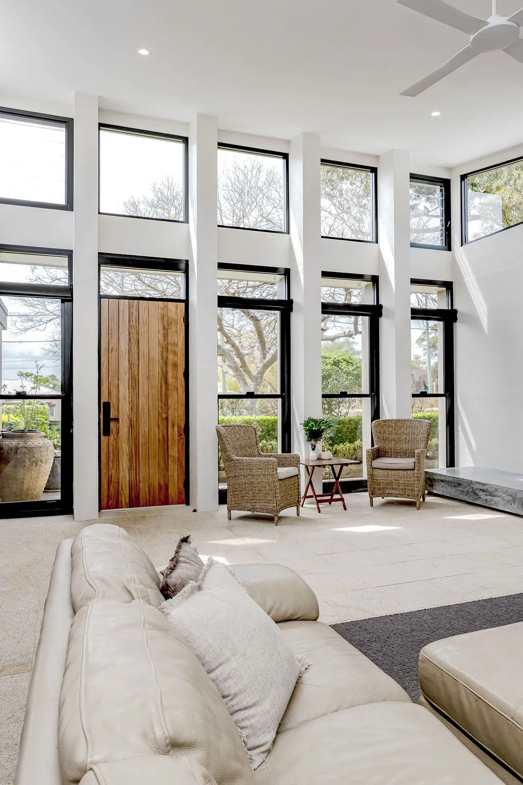 Timber front door and full-height glazing in the new lounge room