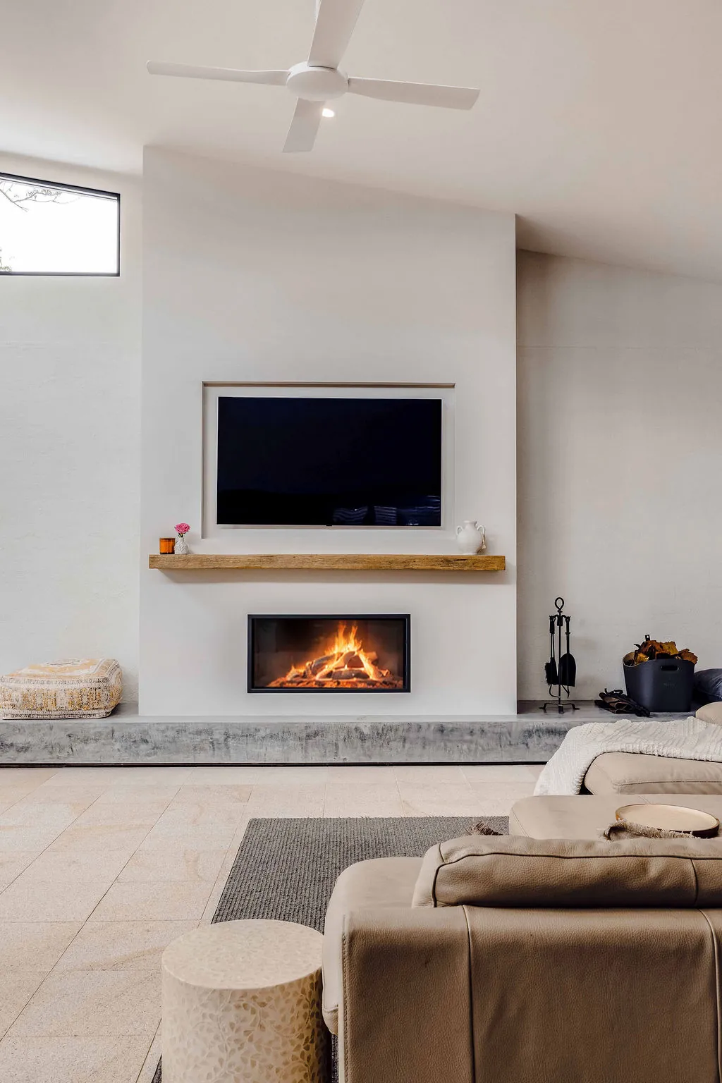 New fireplace set into a rendered feature wall